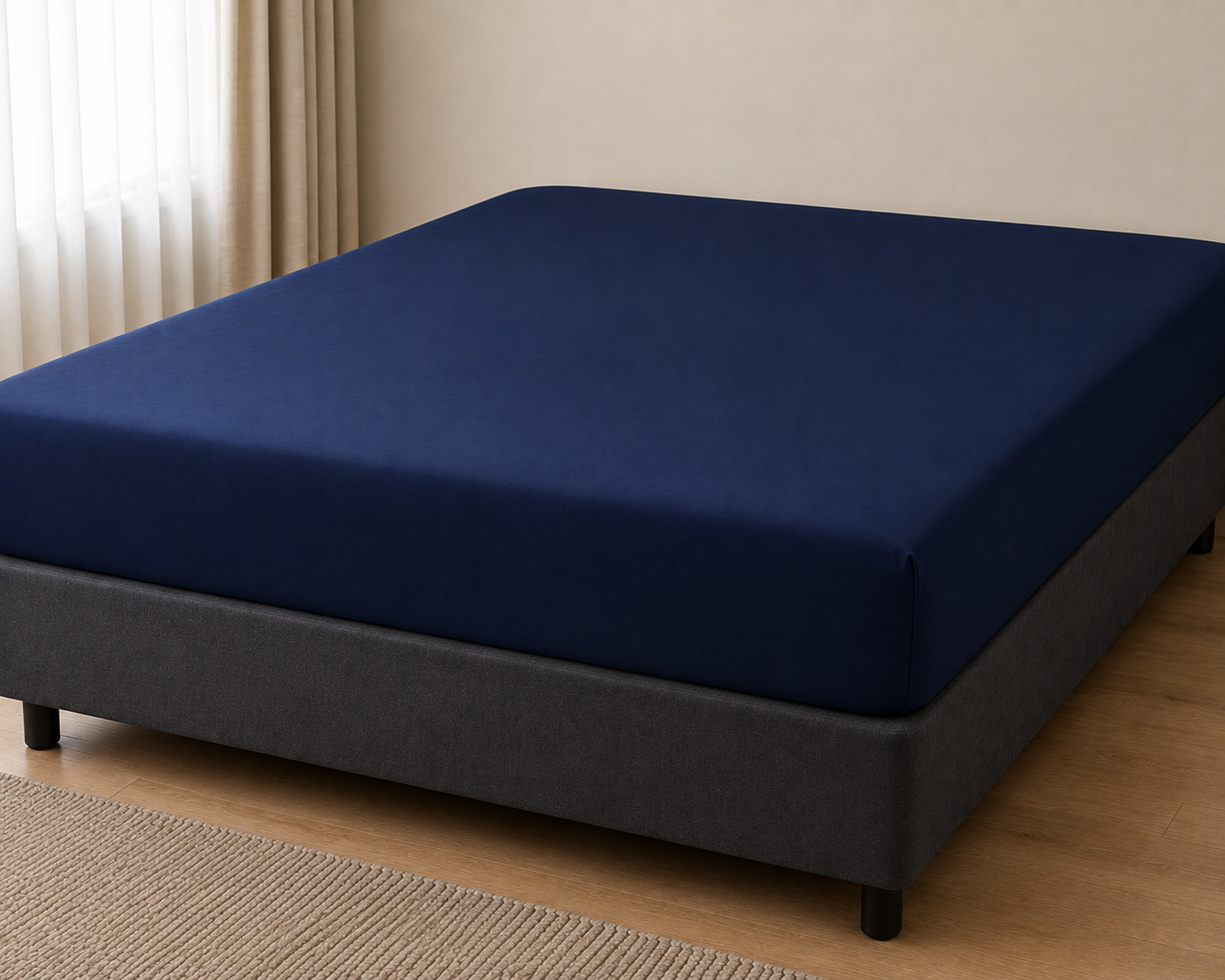 Navy blue King fitted bed sheet on a bed base