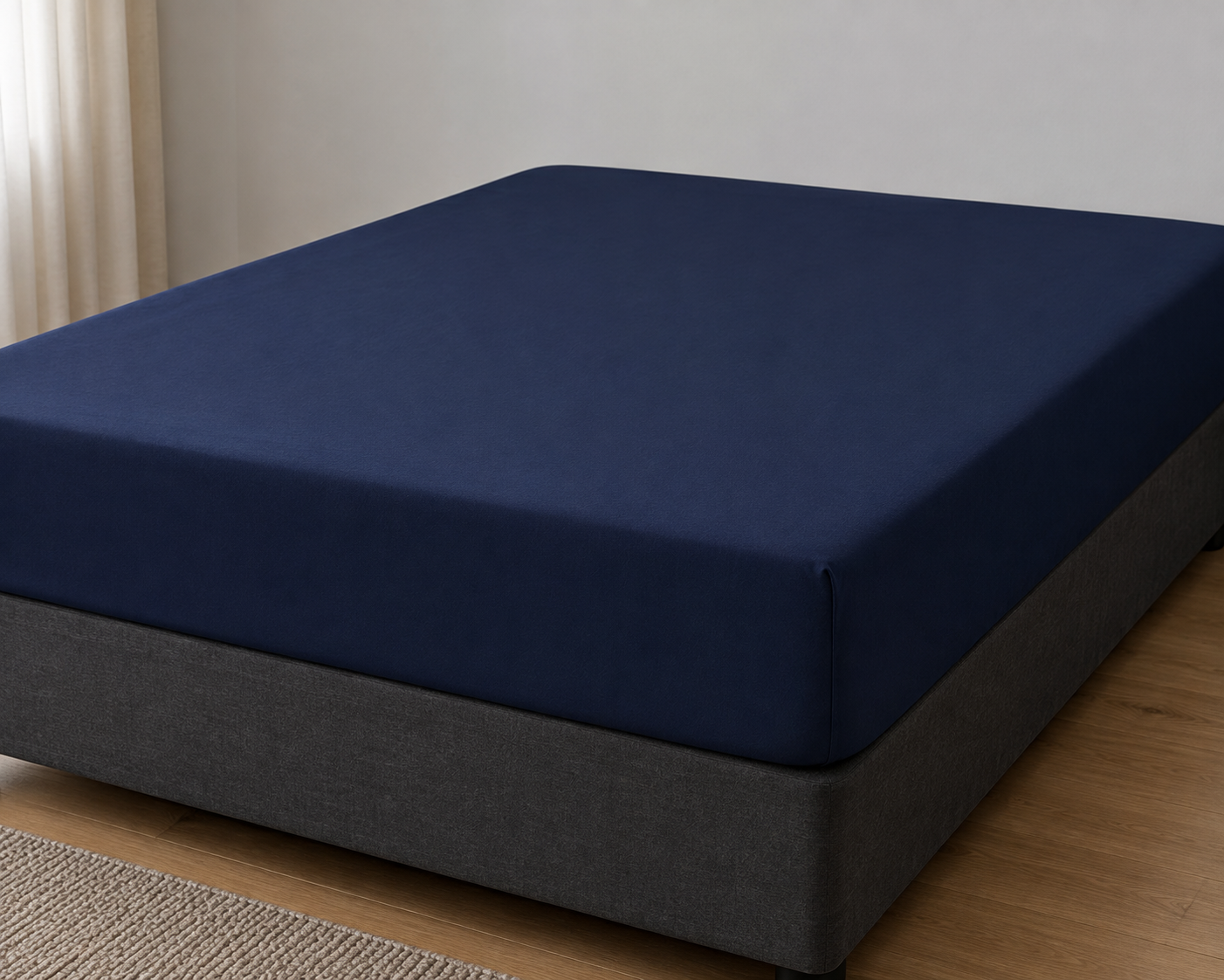 Navy blue Three Quarter fitted bed sheet on a bed base